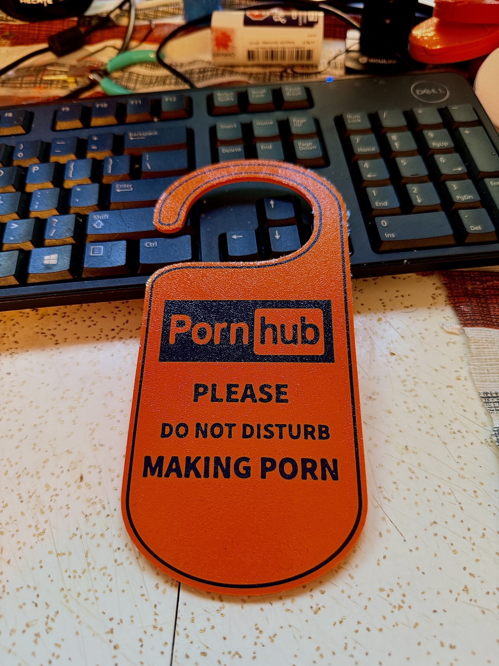 Custom orange novelty door hanger made by Stormy Sailors