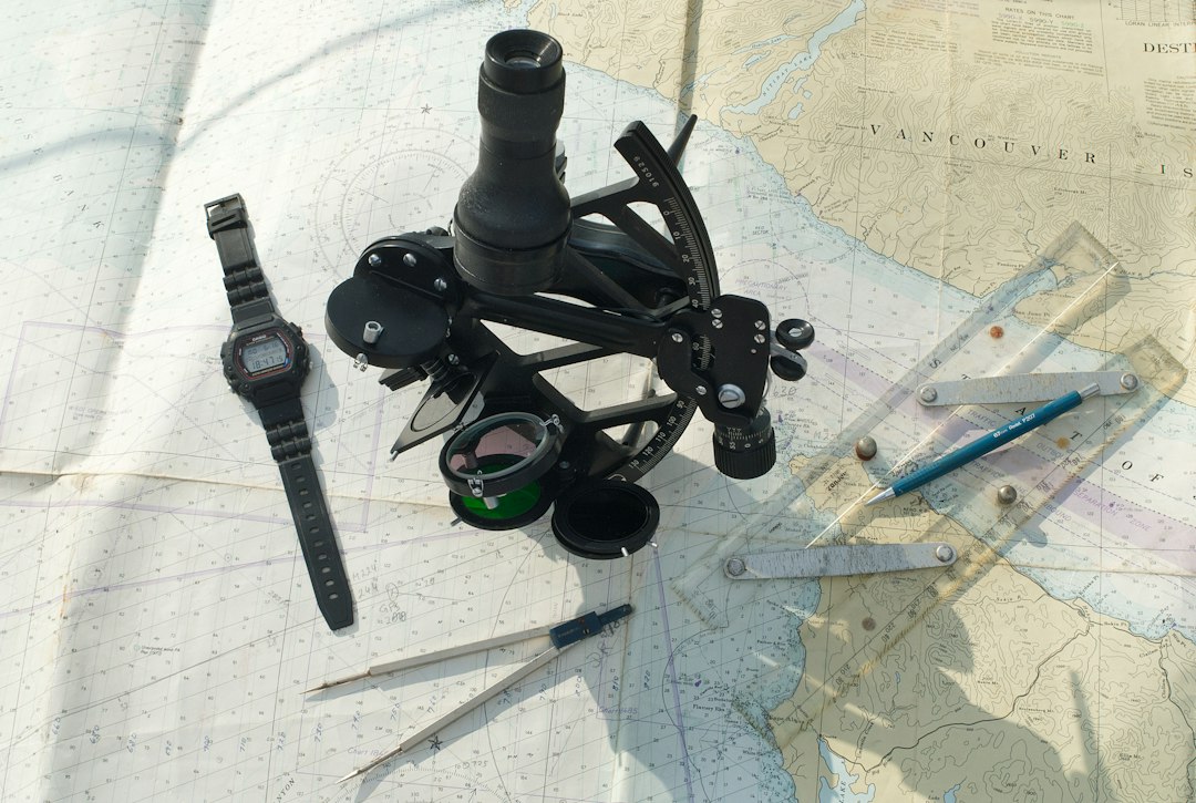 Sextant and navigation instruments arranged on a map